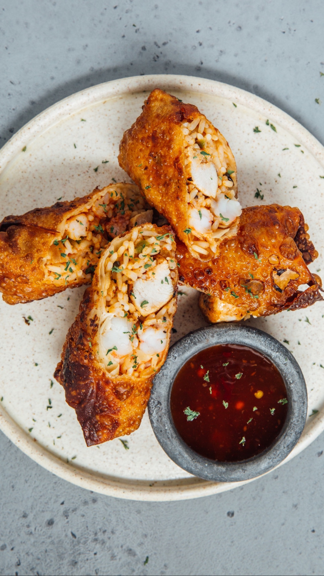 Crisp seafood-filled rolls served with sweet chile dipping sauce